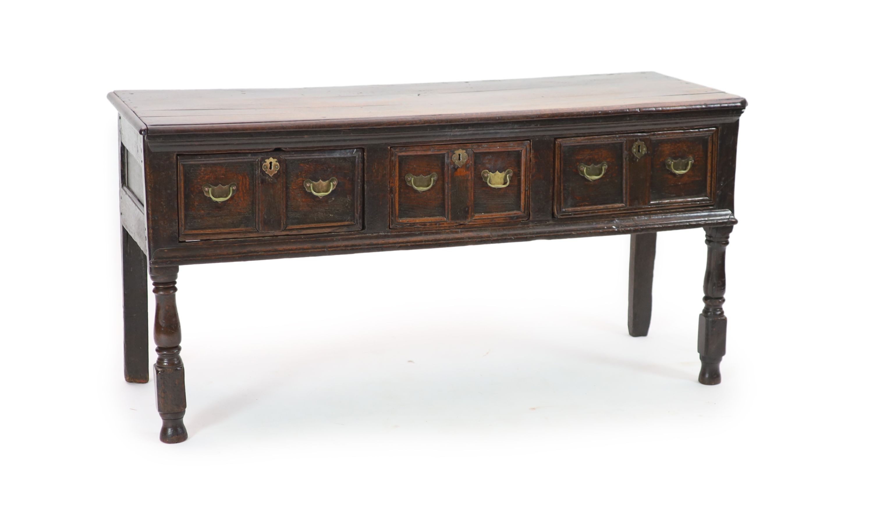 A late 17th century oak low dresser H 76cm. W 154cm. D 54cm.